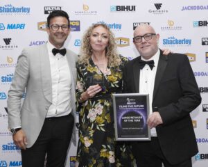 TTA Awards 2026 Large Retailer of the Year L to R Thomas Etheridge Karen Sturt Rod Hodder HIP3918