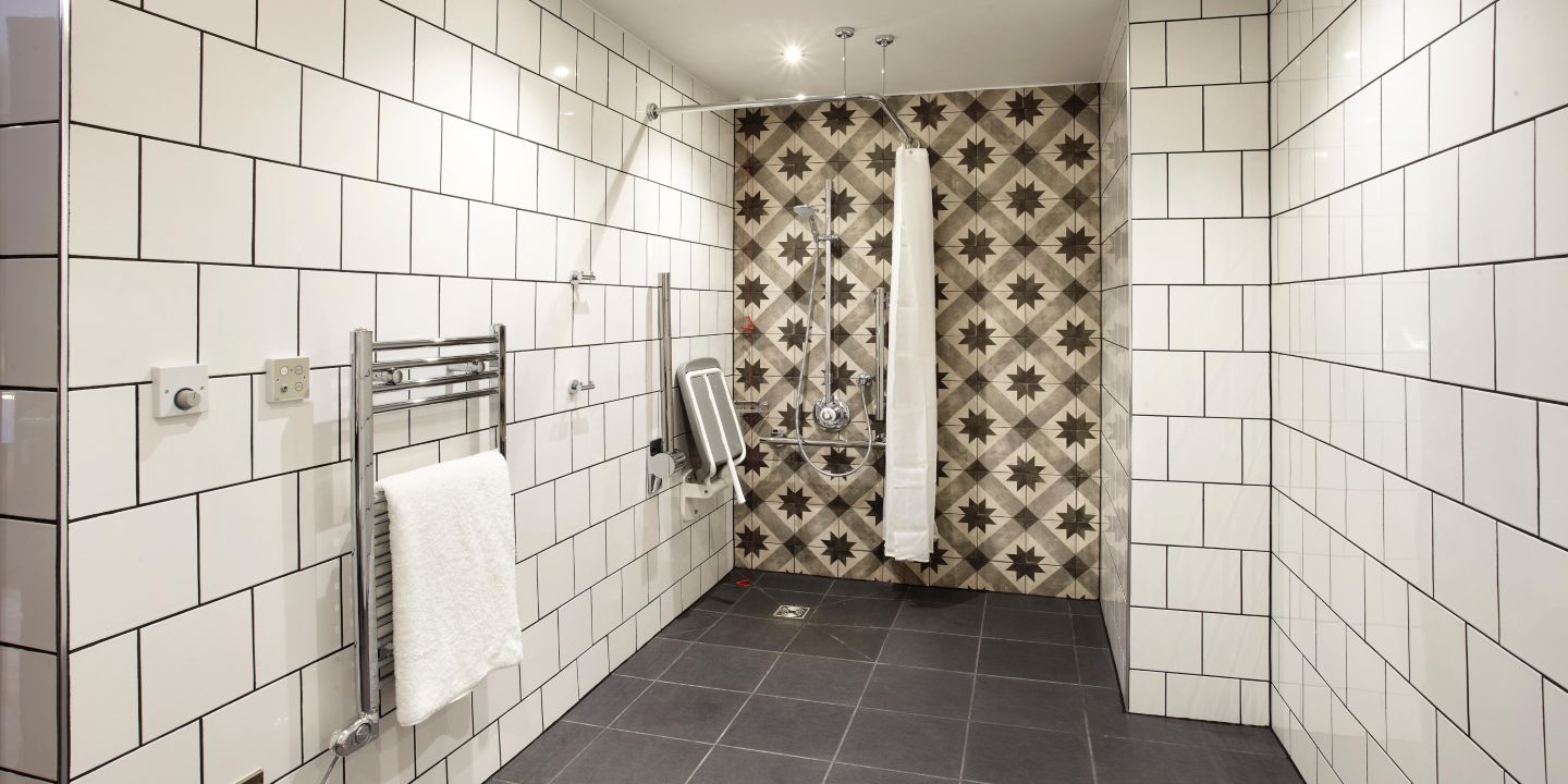 indigo bathroom white shiny tiles square pattern criss cross star pattern image no people photograph photography long smart well organised colour
